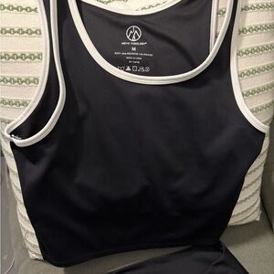 Move Theology Women's Black Sports Bra and leggings